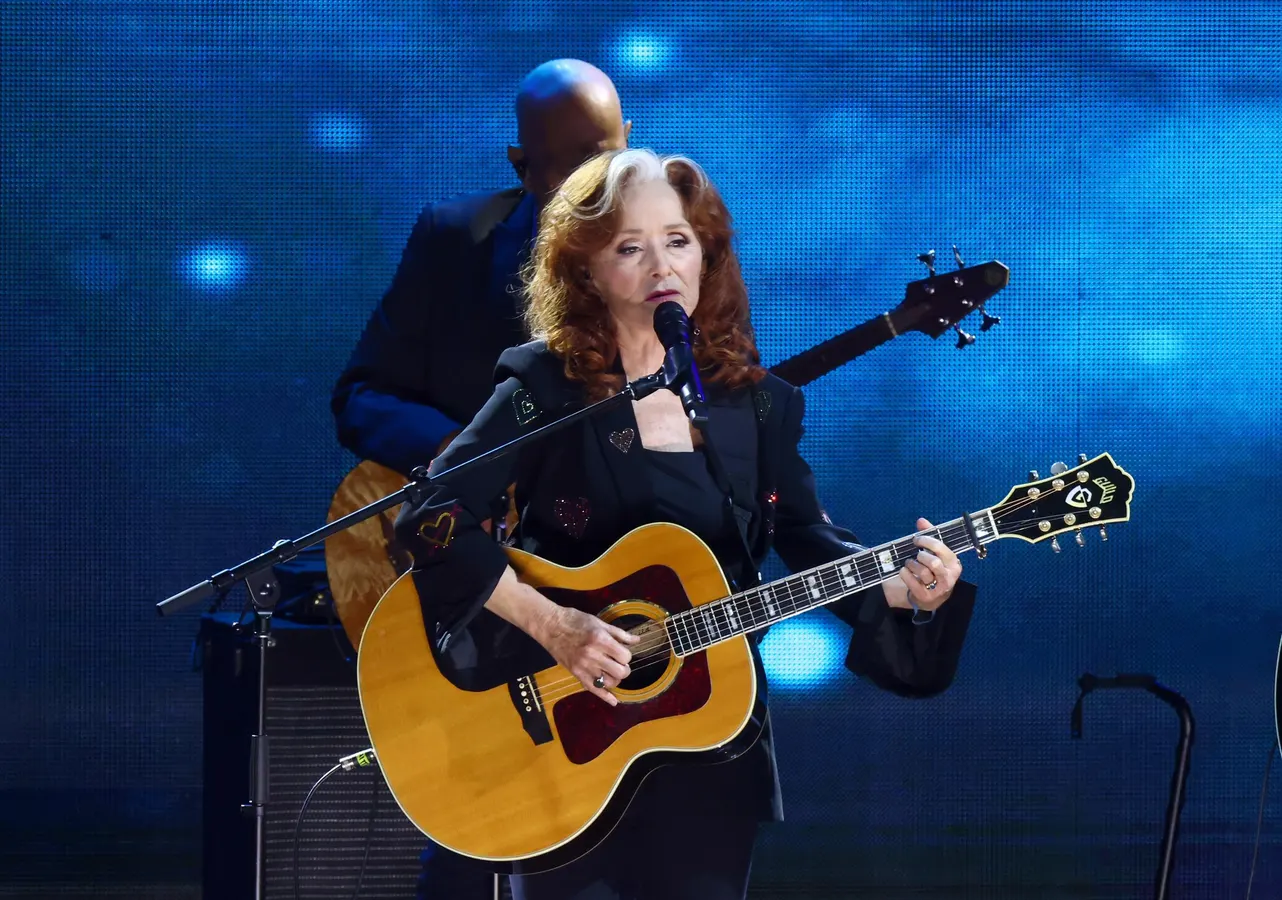 Bonnie Raitt.  The voice of a fleshy velvet seductress tamed only by her Fender Stratocaster.